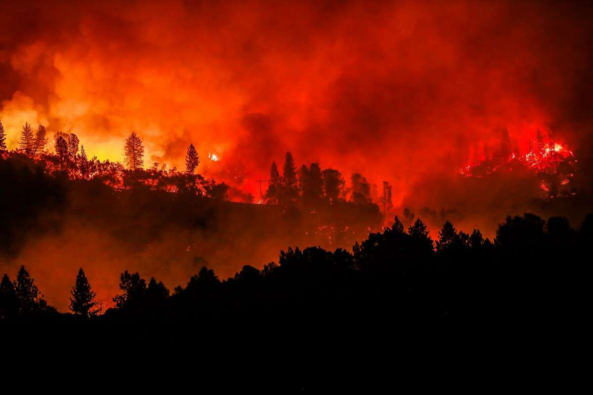 The Camp Fire burns along a ridgetop near Big Bend, Calif., on Saturday, Nov. 10, 2018.