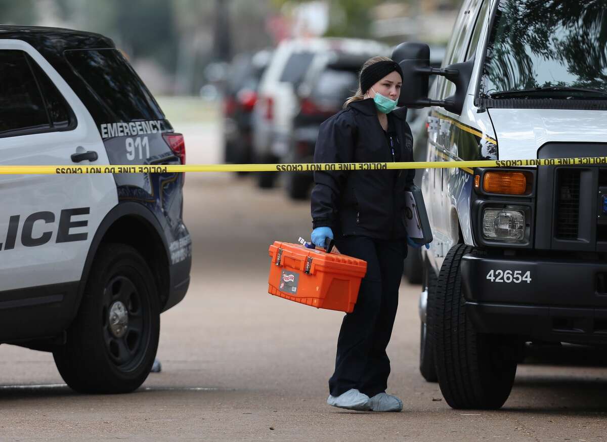 HPD and Houston Forensic Science Center officials investigate the scene where a shooting left one Lamar High School student dead near the intersection of Bammel Lane and Philfall Street on Tuesday, Nov. 13, 2018, in Houston.