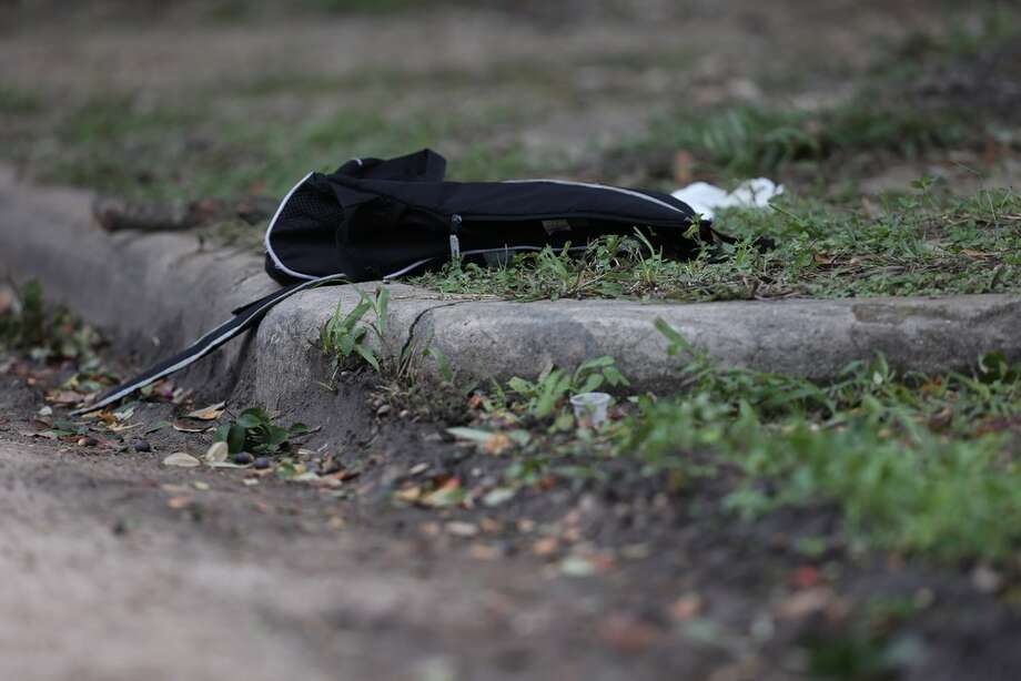 A black backpack is left at the scene where a shooting left one Lamar High School student dead near the intersection of Bammel Lane and Philfall Street on Tuesday, Nov. 13, 2018, in Houston. Photo: Yi-Chin Lee / Houston Chronicle