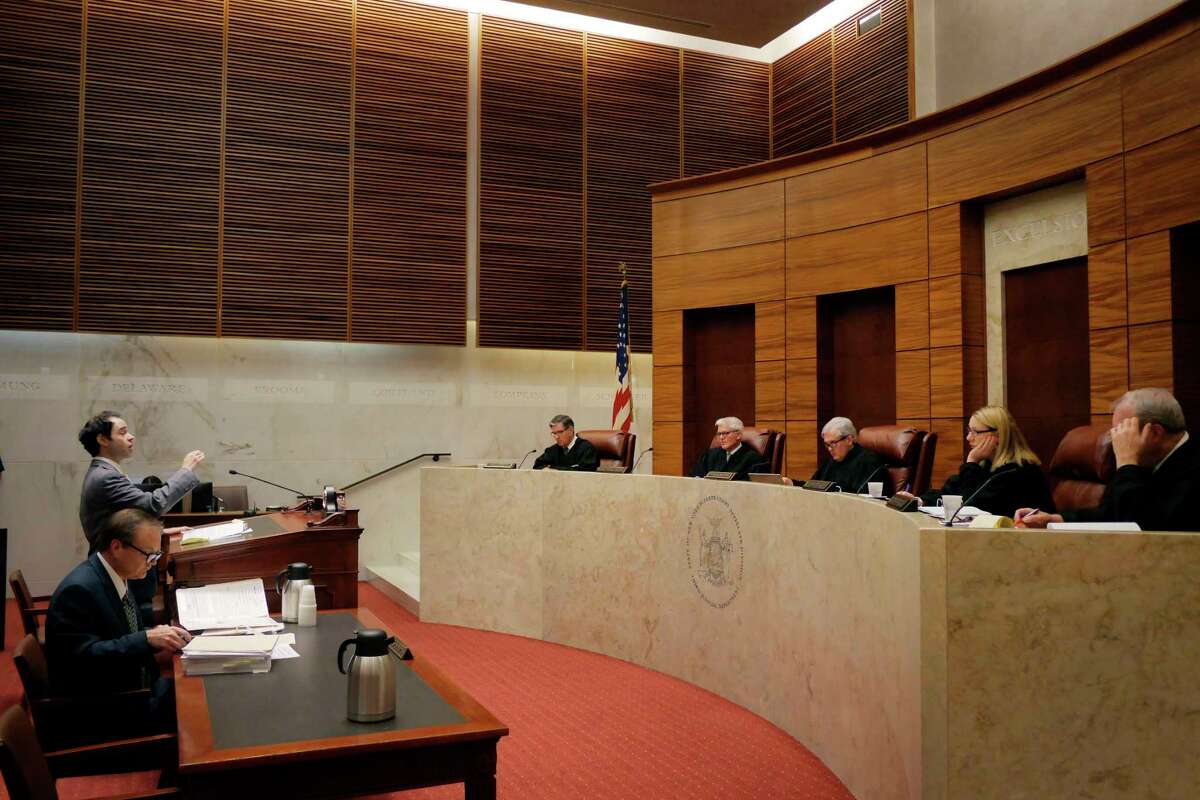 Joshua Kelner, standing at podium, argues in front of the justices of the State of New York Supreme Court, Appellate Division Third Judicial Department in the case of Dukes v State of New York on Tuesday, Nov. 13, 2018, in Albany, N.Y. Kelner was representing Carl Dukes in the case. Frank Brady, seated, was representing the State of New York in the case. (Paul Buckowski/Times Union)