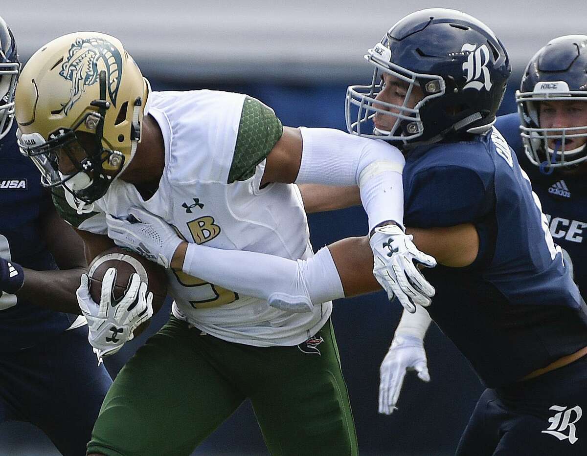 UAB running back Jarrion Street, left, is tackled by Rice defensive back Prudy Calderon during the second half of an NCAA college football game, Saturday, Oct. 13, 2018, in Houston. (Eric Christian Smith/Contributor)