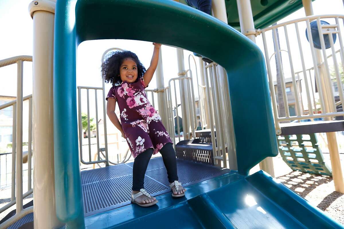 Maipele Burns, 4, prepares to go down the slide while playing in the park across the street from her home in Camarillo, Calif, on Oct. 18, 2018. Maipele was diagnosed at the age of 2 with Acute flaccid myelitis, causing permanent paralysis in her right arm. (Mel Melcon/Los Angeles Times/TNS)