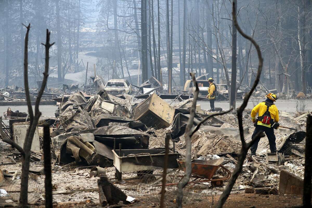 A Monterey firefighters put out small hot spots in Eden Rock Estates in aftermath of Camp Fire in Paradise, Calif. on Tuesday, November 13, 2018.