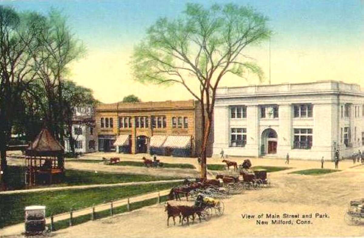 This early 20th century view from the former Village Hardware at the corner of Main and Church streets shows the block between Bridge and Bank streets ravaged by the Great Fire of 1902 had been rebuilt several years later and looking much as it does today. What is referred to as the