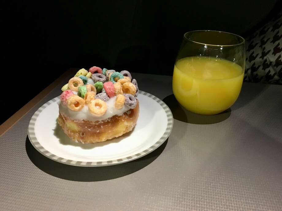 A whimsical dessert that I've never had on an airplane before: Randy's Donuts from the Los Angeles institution, served on Singapore Airlines china. Photo: Tim Jue