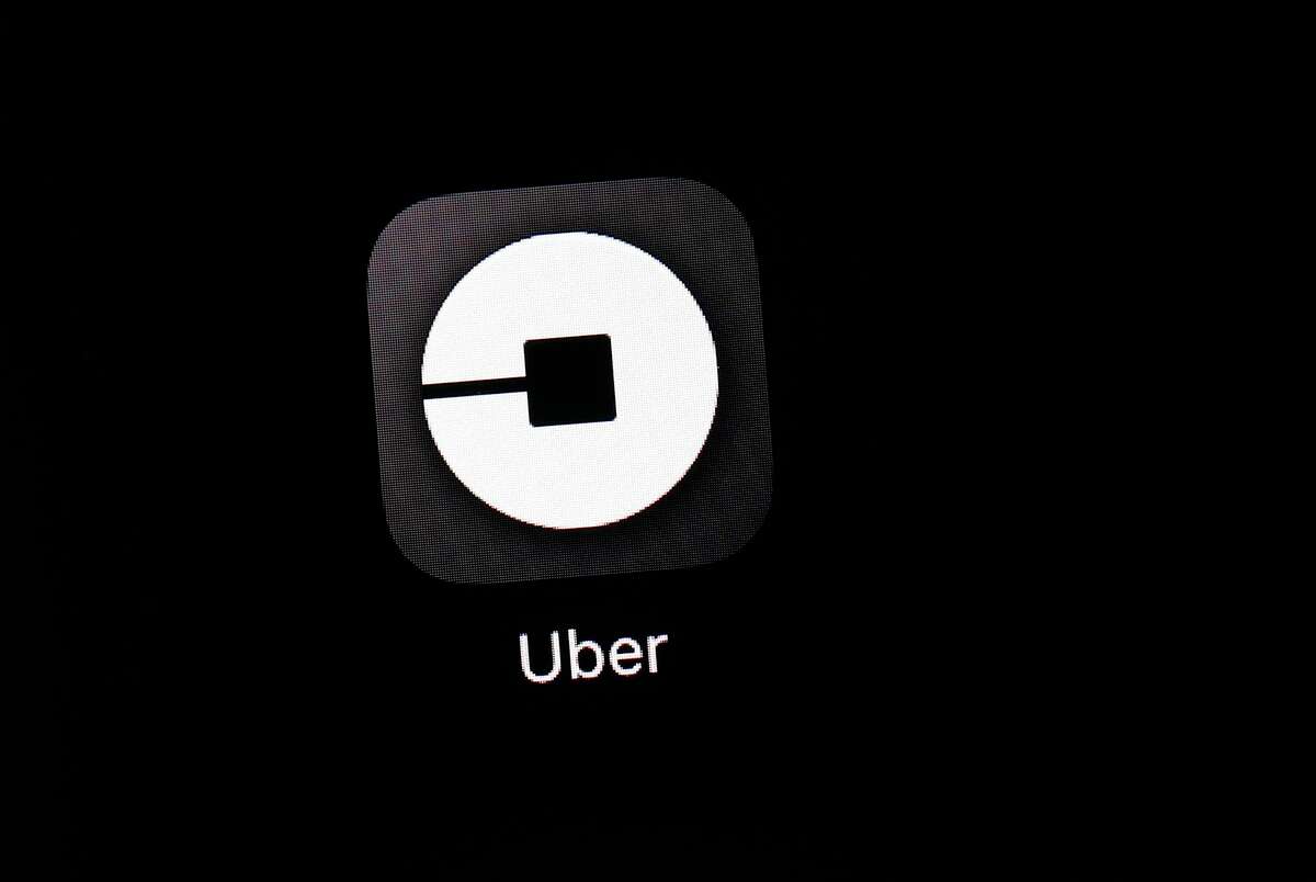 FILE- This March 20, 2018, file photo shows the Uber app on an iPad in Baltimore.