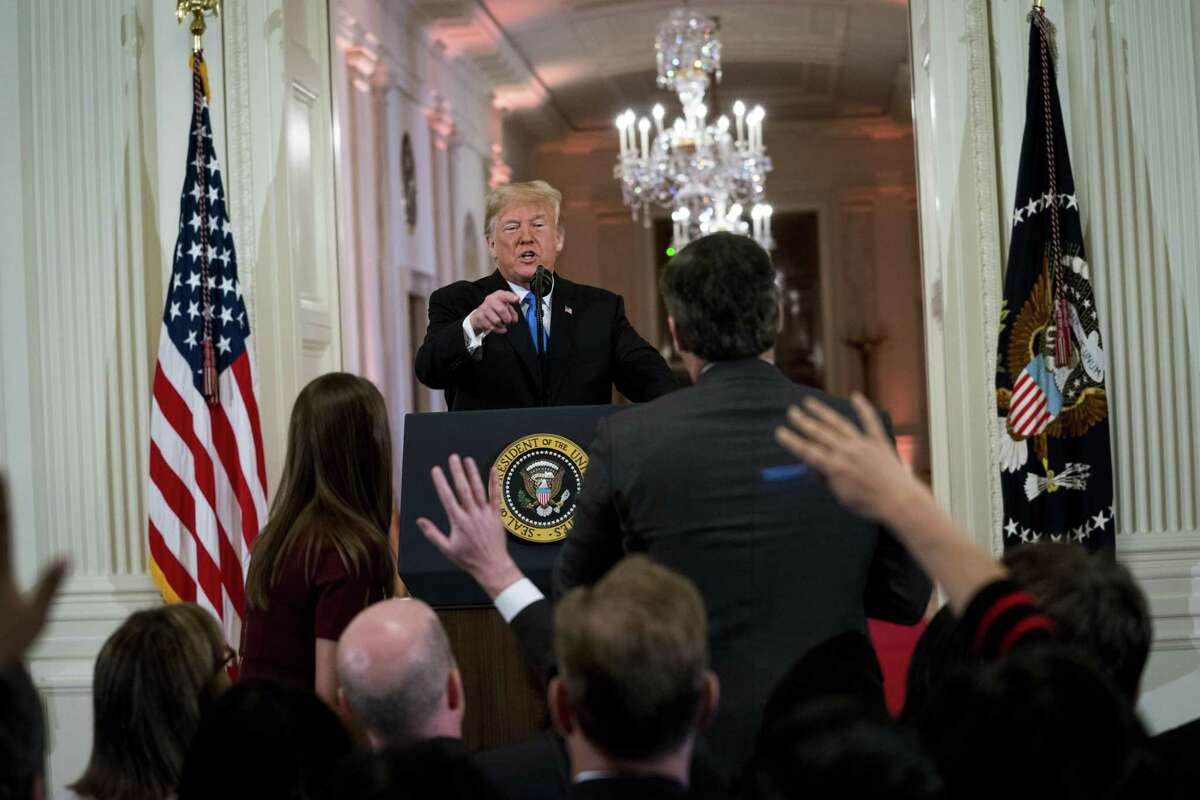 President Donald Trump has a heated exchange with CNN reporter Jim Acosta at a 2018 news conference about the results of the midterm elections.