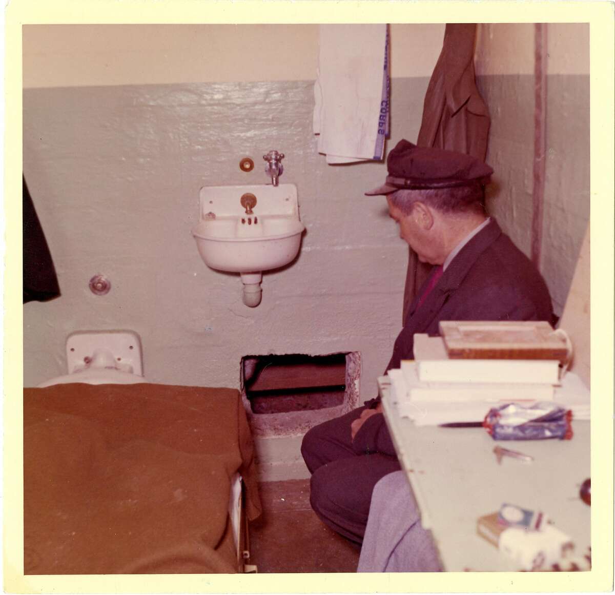 This 1962 photo from the U.S. Penitentiary Alcatraz shows Frank Morris's cell and Senior Officer Howard Waldron looking at the point of escape. Monday, June 11th marks the 50th anniversary of the escape of three prisoners from U.S. Penitentiary Alcatraz in San Francisco, Calif. The U.S. Marshals Service to this day continues to have an open case on the escape.