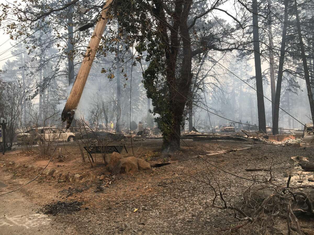 Jeff Hill shares photos of his property and cars which were burned in the Camp Fire in Paradise, Calif.