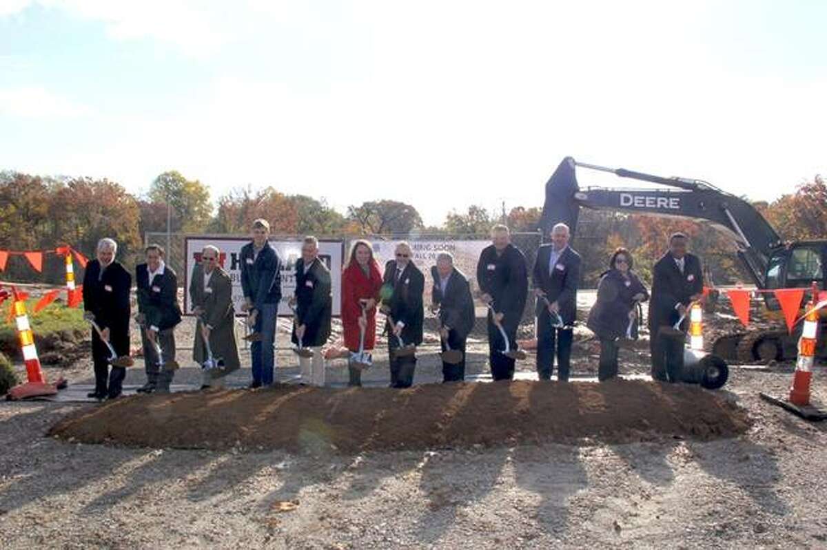 Fireside Financial representatives dig in at a groundbreaking ceremony at the development site of Whispering Heights on Nov. 6. This mixed-use community will include 153 luxury apartment homes and over 18,000 square feet of retail and restaurant space. It’s set to open Fall 2019. Mike and Kristie Bailey of Fireside Financial are pictured, along with various members of the project team.