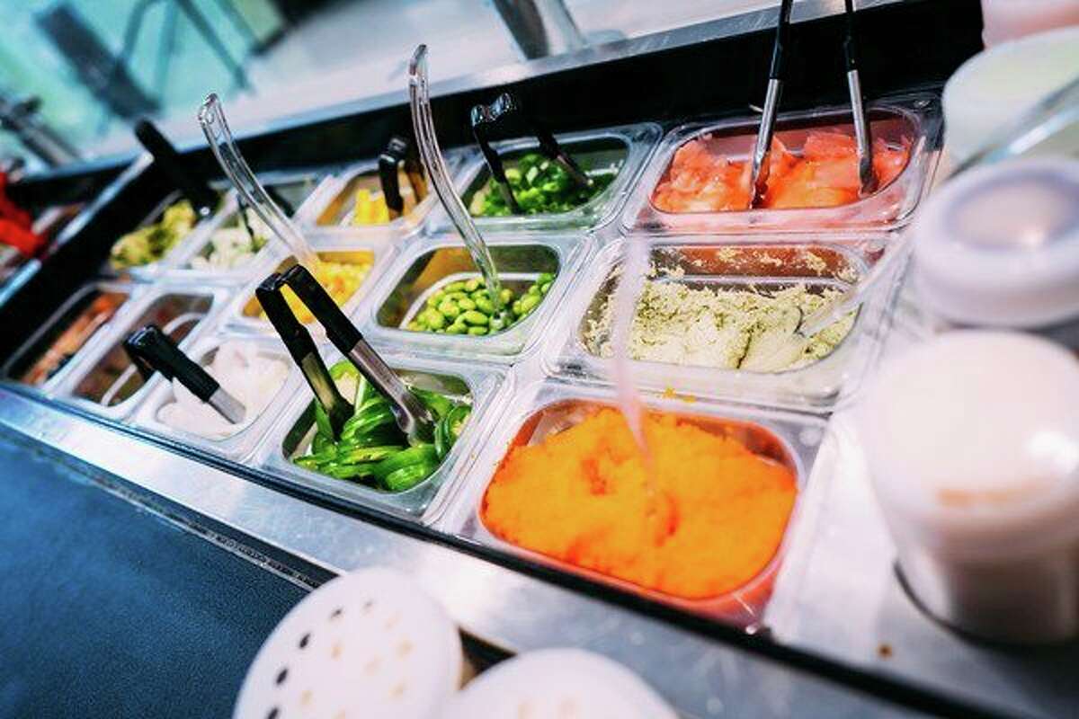 The bar at Sushi Remix features some of the freshest ingredients, as pictured here. Sushi Remix specializes in poke-bowls, which is a bowl of deconstructed sushi. (Photo courtesy of Full Steam Social Media)
