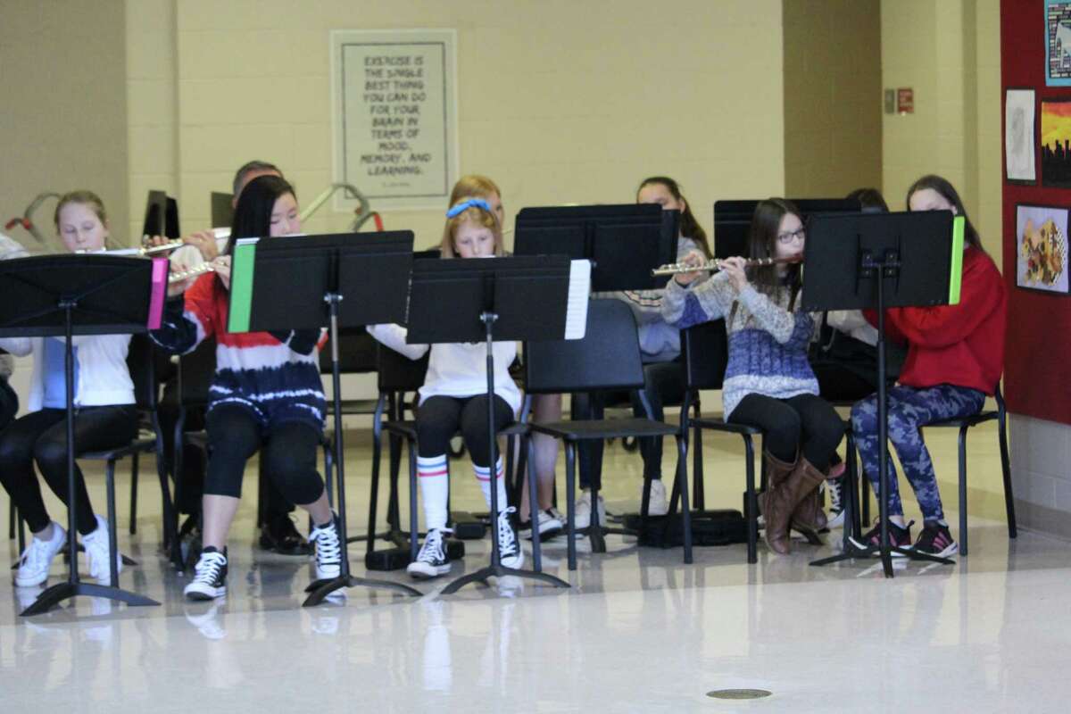 Students conducted a symphony to welcome veterans as they entered Saxe Middle school. Taken Nov. 12.