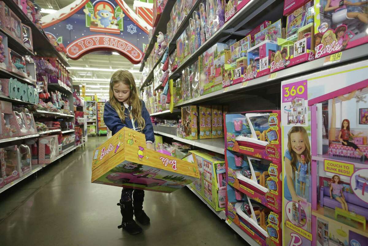 Eva Luna, 6, looks at a Barbie item at Walmart, 1118 Silber Rd., Monday, Nov. 12, 2018, in Houston.