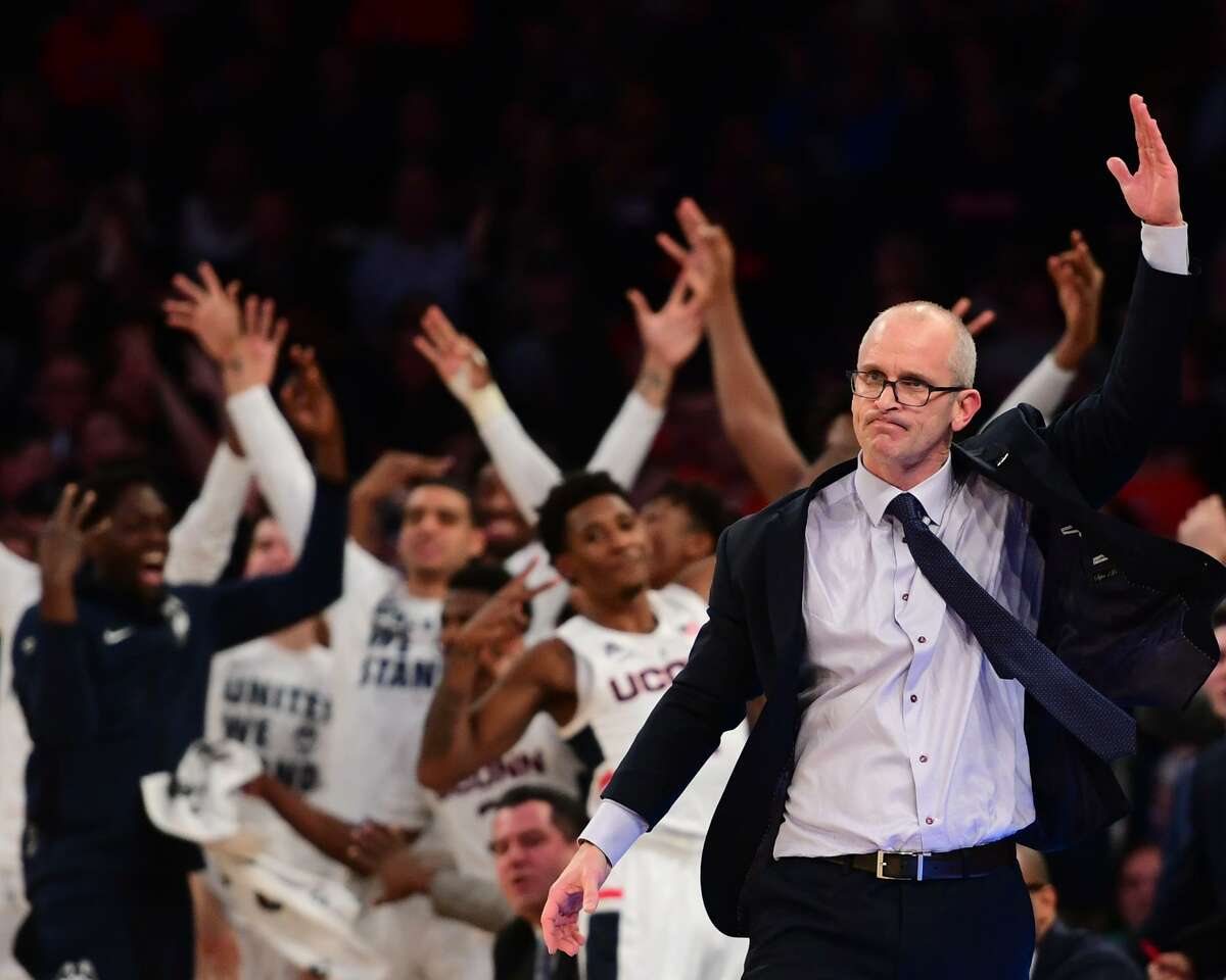 UConn coach Dan Hurley reacts as the bench celebrates after a Huskies rebound in the first half of Thursday’s game against Syracuse in the 2k Empire Classic at Madison Square Garden in New York.