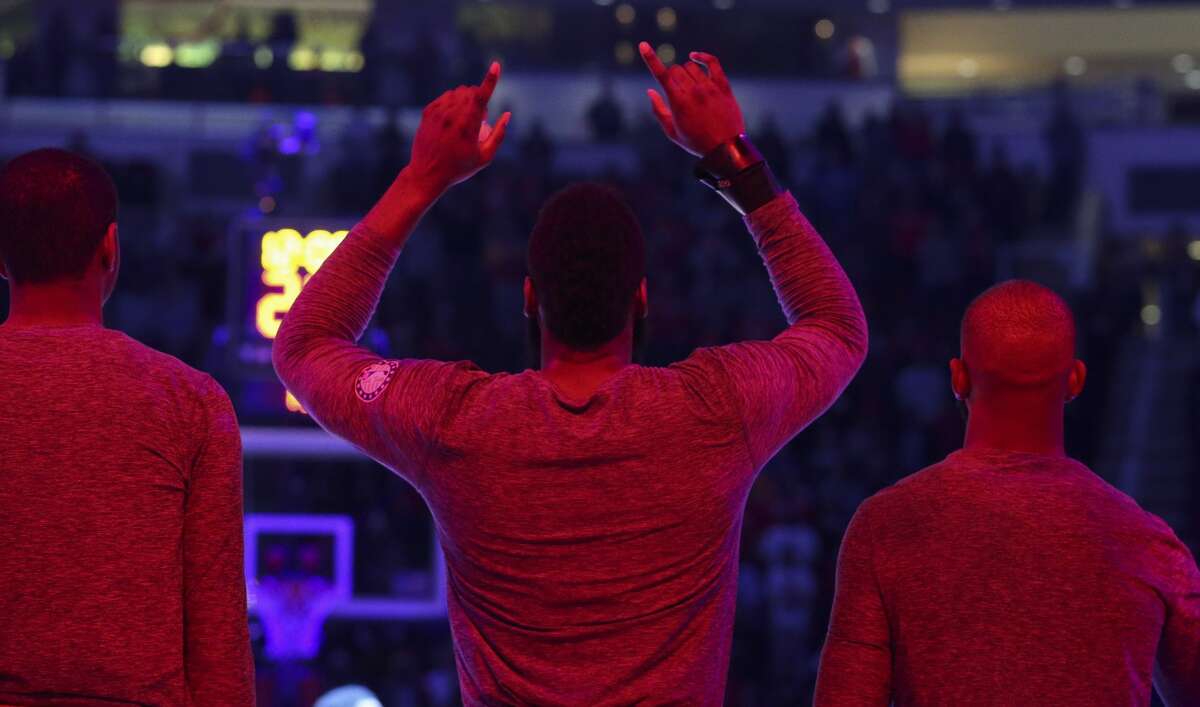 Houston Rockets guard James Harden (13) points to the sky after national anthem of the NBA game at against the Golden State Warriors Toyota Center on Thursday, Nov. 15, 2018, in Houston.