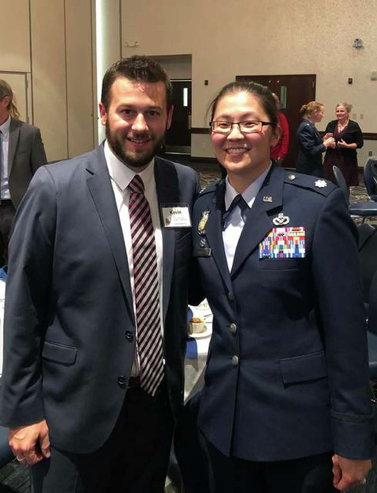 Lt. Col. Nichole Scott (right) stands with TheBank of Edwardsville’s Kevin Welch. The two are to be paired up in the Honorary Commanders Program at Scott AFB.