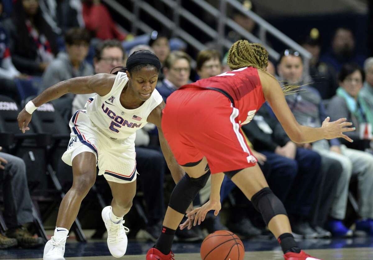 UConn’s Crystal Dangerfield (5) attempts a steal against Ohio State’s Adreana Miller (15) on Nov. 11 in Storrs.