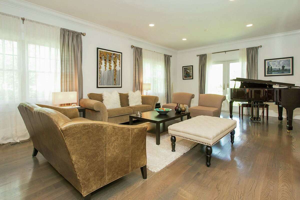 The formal living room at 246 Riverside Ave. in Riverside features a new gas fireplace and space for a baby grand piano.