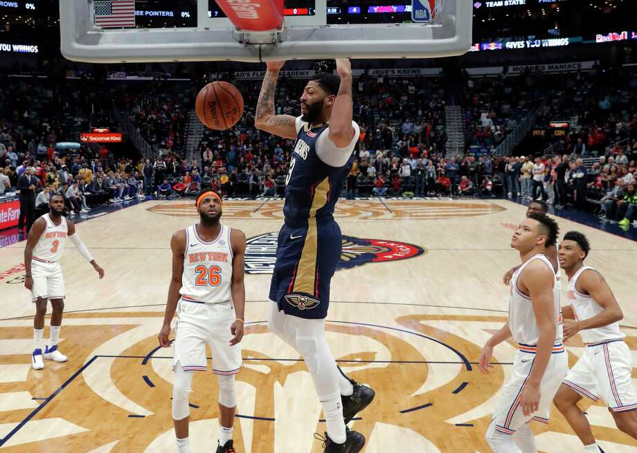 Striker Anthony Davis (23) of the New Orleans Pelicans strikes in front of the New York Knicks Center, Mitchell Robinson (26), in the first half of an NBA basketball game at New Orleans, Friday, November 16, 2018. (AP Photo / Gerald Herbert) Photo: Gerald Herbert / Copyright 2018 The Associated Press. All rights reserved.