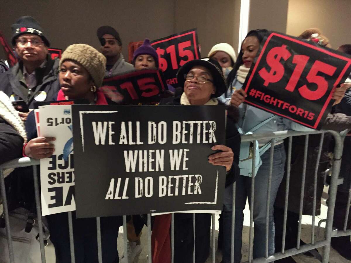 Hundreds of demonstrators bused up from the outer boroughs of New York City led the large Fight for $15 protest to raise the minimum wage prior in the Empire State Plaza concourse Wednesday prior to Gov. Andrew Cuomo's State of the State address. (Paul Grondahl / Times Union)
