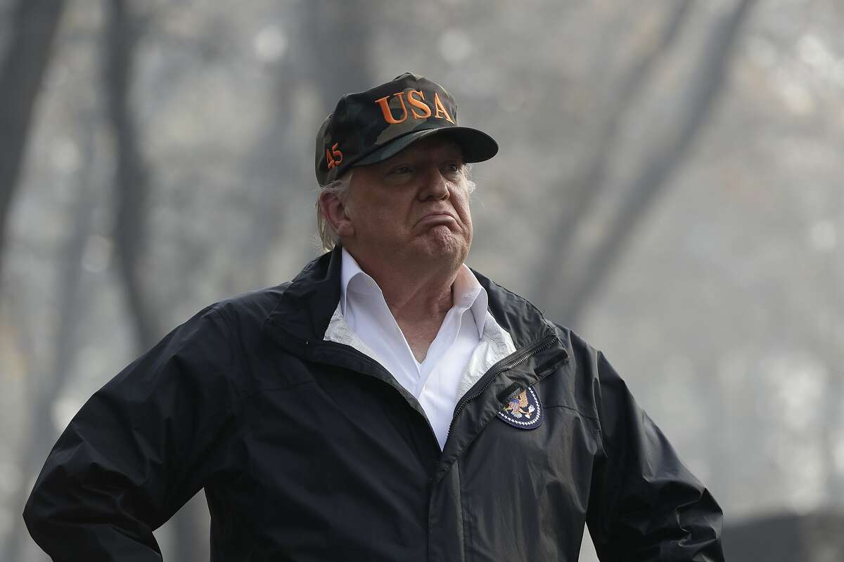 President Donald Trump visits a neighborhood impacted by the wildfires, on Nov. 17, 2018, in Paradise, Calif.