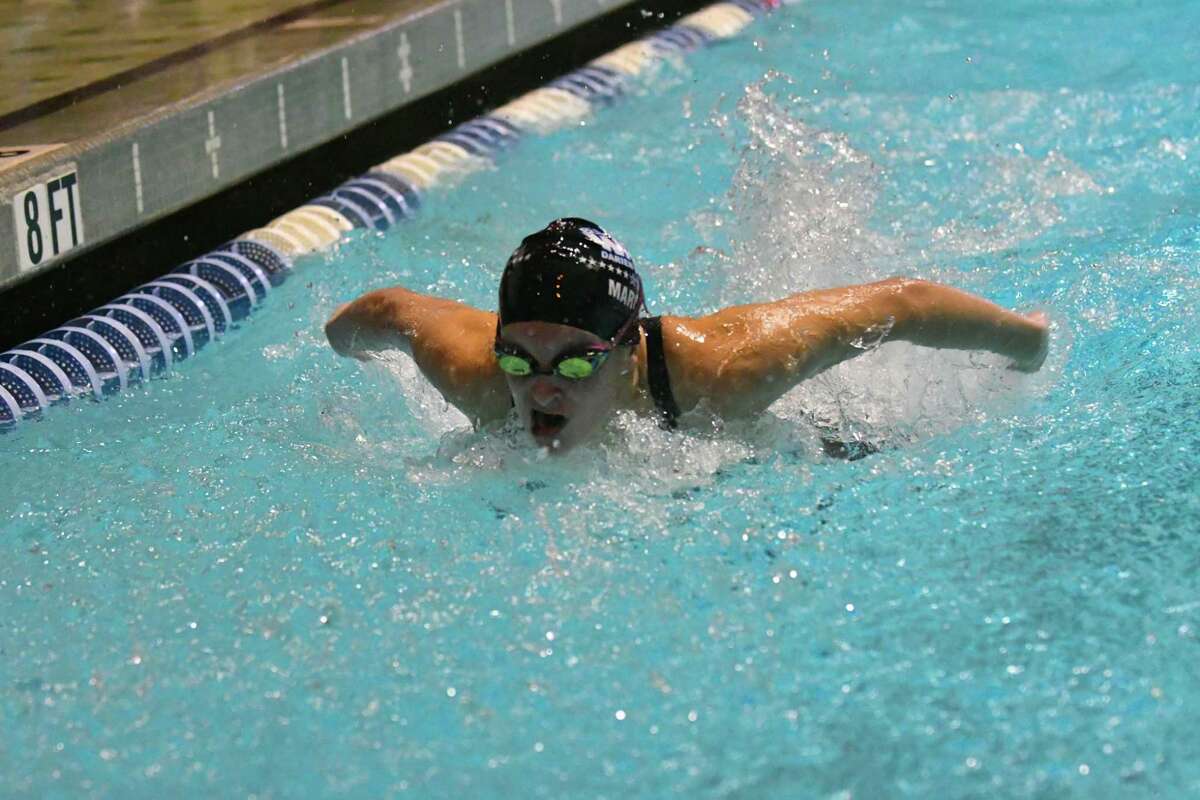 Cassandra Maroney of the Darien Blue Wave swims in the 100-yard butterfly during the CIAC Open Swimming Championships on Saturday at Yale University in New Haven.
