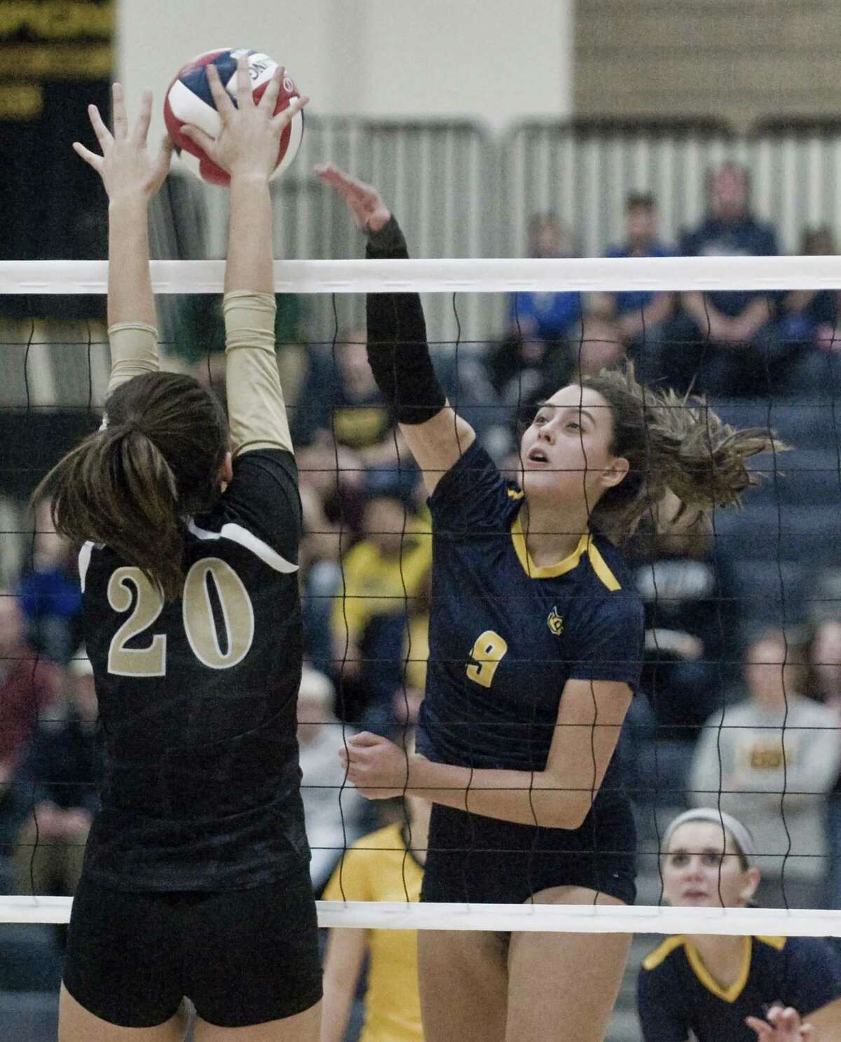 Woodstock Academy's Paula Hernandez Aulet tips the ball over the net in the class L volleyball championship game against Joel Barlow High School, played at East Haven High School. Nov. 17, 2018