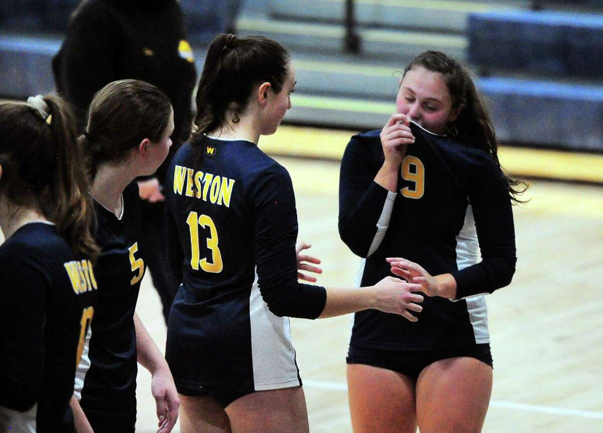 Weston teammates react after being beat by Seymour during Class M girls volleyball championship action in East Haven, Conn., on Saturday Nov. 17, 2018.