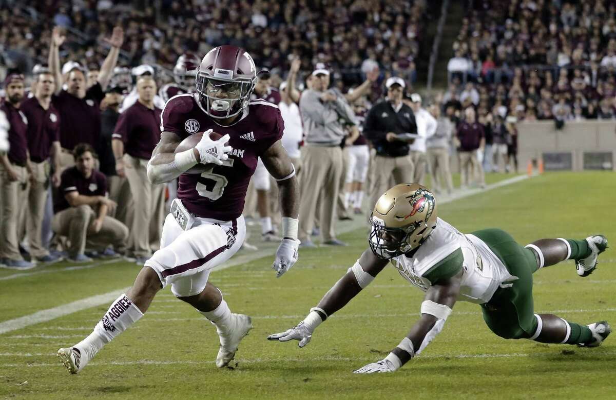 PHOTOS: Former Texas HS quarterbacks who have started in NFL playoffs  Texas A&M running back Trayveon Williams (5) dodges the tackle attempt by UAB linebacker Chris Woolbright, right, to score during the first half of an NCAA college football game Saturday, Nov. 17, 2018, in College Station, Texas. (AP Photo/Michael Wyke) >>>Browse through the photos for a look at former Texas HS QBs who have started in the NFL playoffs ... 