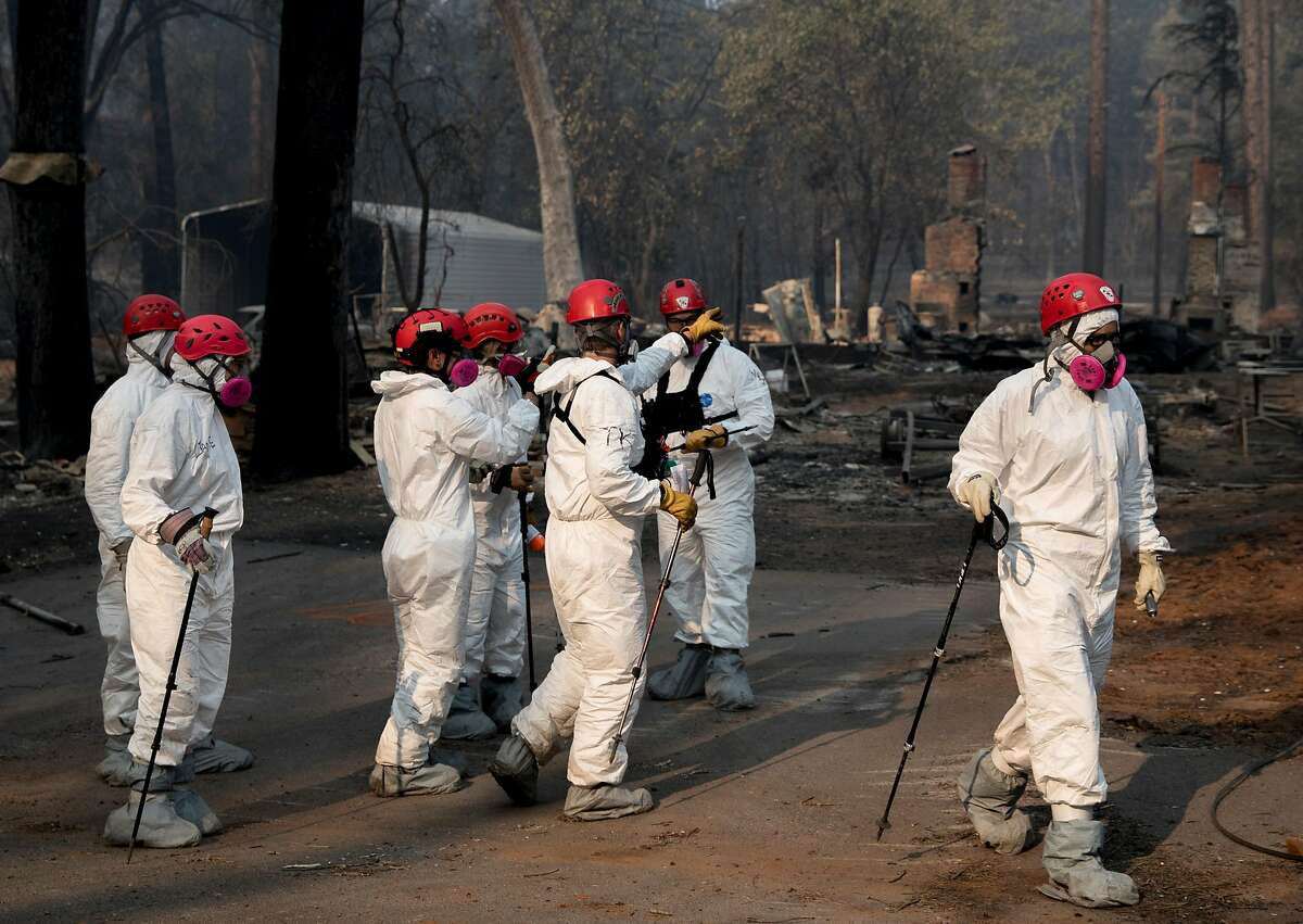 Search and Rescue crews sift through the rubble of homes for human remains in Paradise, Calif. Saturday, Nov. 17, 2018 after the Camp Fire ripped through the entire town.