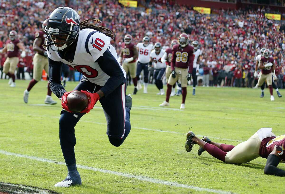 Texans wide receiver DeAndre Hopkins (10) runs into the end zone for a touchdown against Washington during the first quarter Sunday.