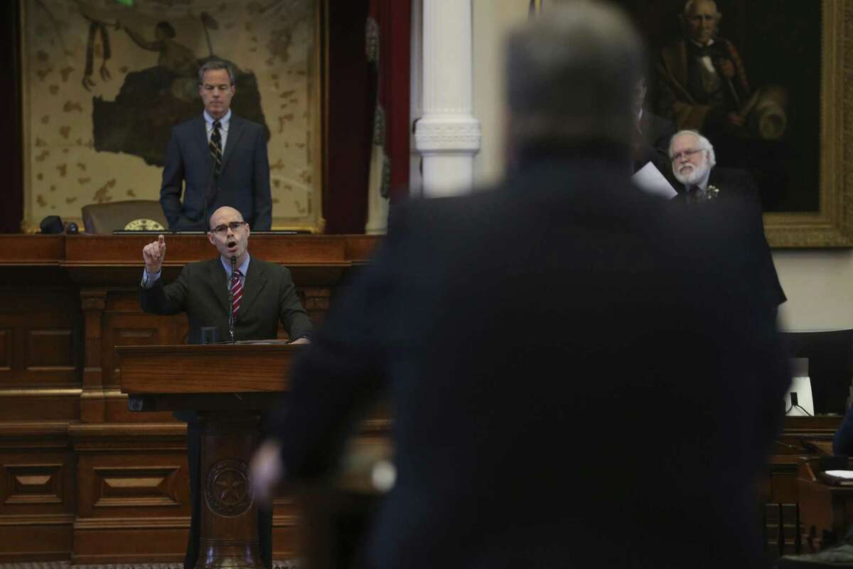 Texas State Rep. Dennis Bonnen, R-Angleton, left, discusses the property tax bill with Rep. Jonathan Stickland, R-Bedford, during the Special Session, Monday August 14, 2017.