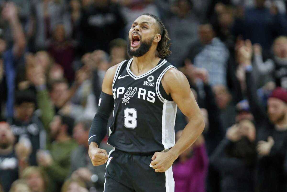 Patty Mills celebrates after hitting a 3-pointer with 39.8 seconds to go in the fourth quarter that gave the Spurs a 101-92 lead and sealed a win over Golden State on Sunday.