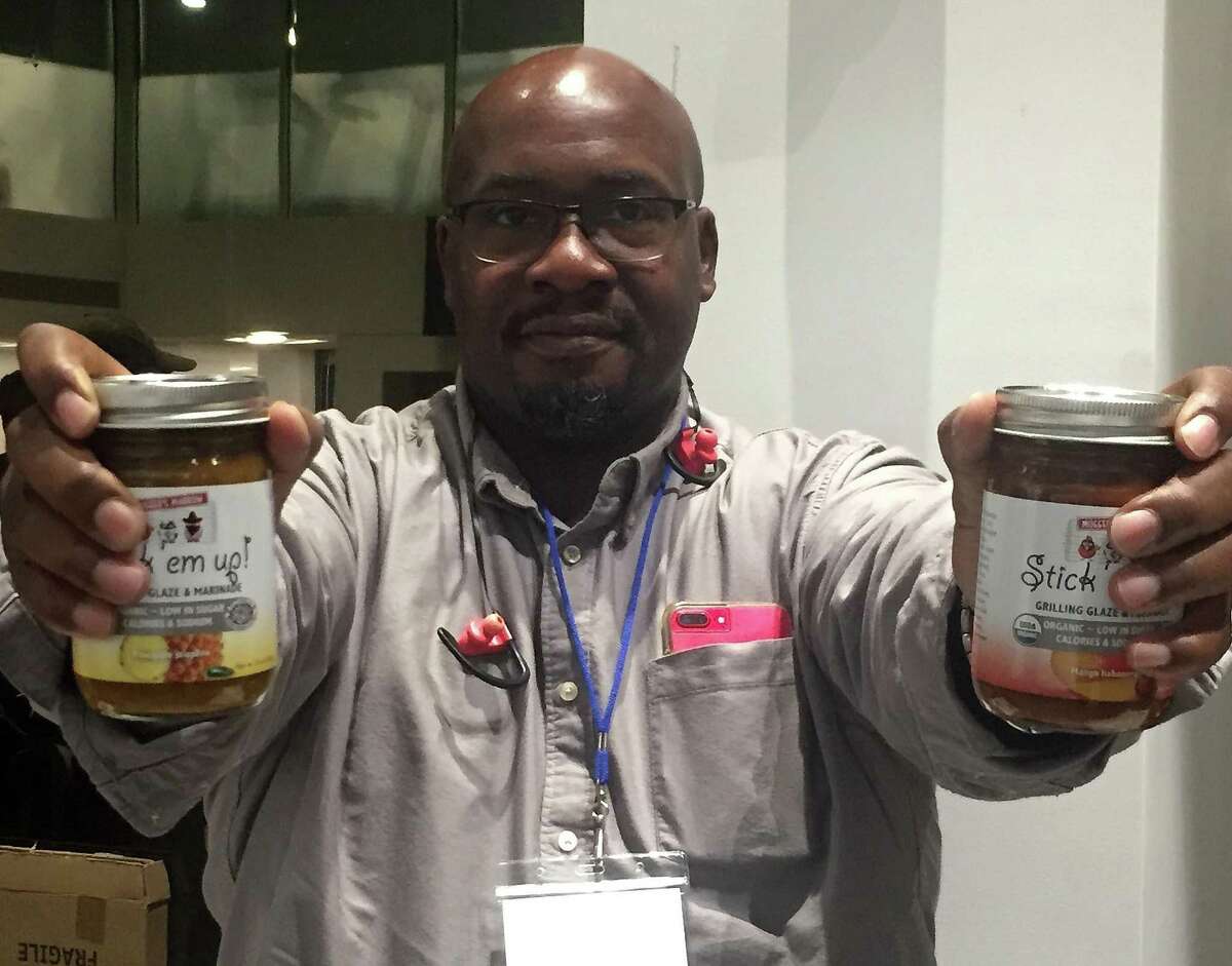 Maurice Jenkins, founder of Stratford-based Mugger’s Marrow, shows his product at a showcase for companies in The Business Council of Fairfield County’s Food’NBev Connect accelerator program, on Tuesday, Nov. 13, 2018, at the Shippan Landing complex in Stamford, Conn.
