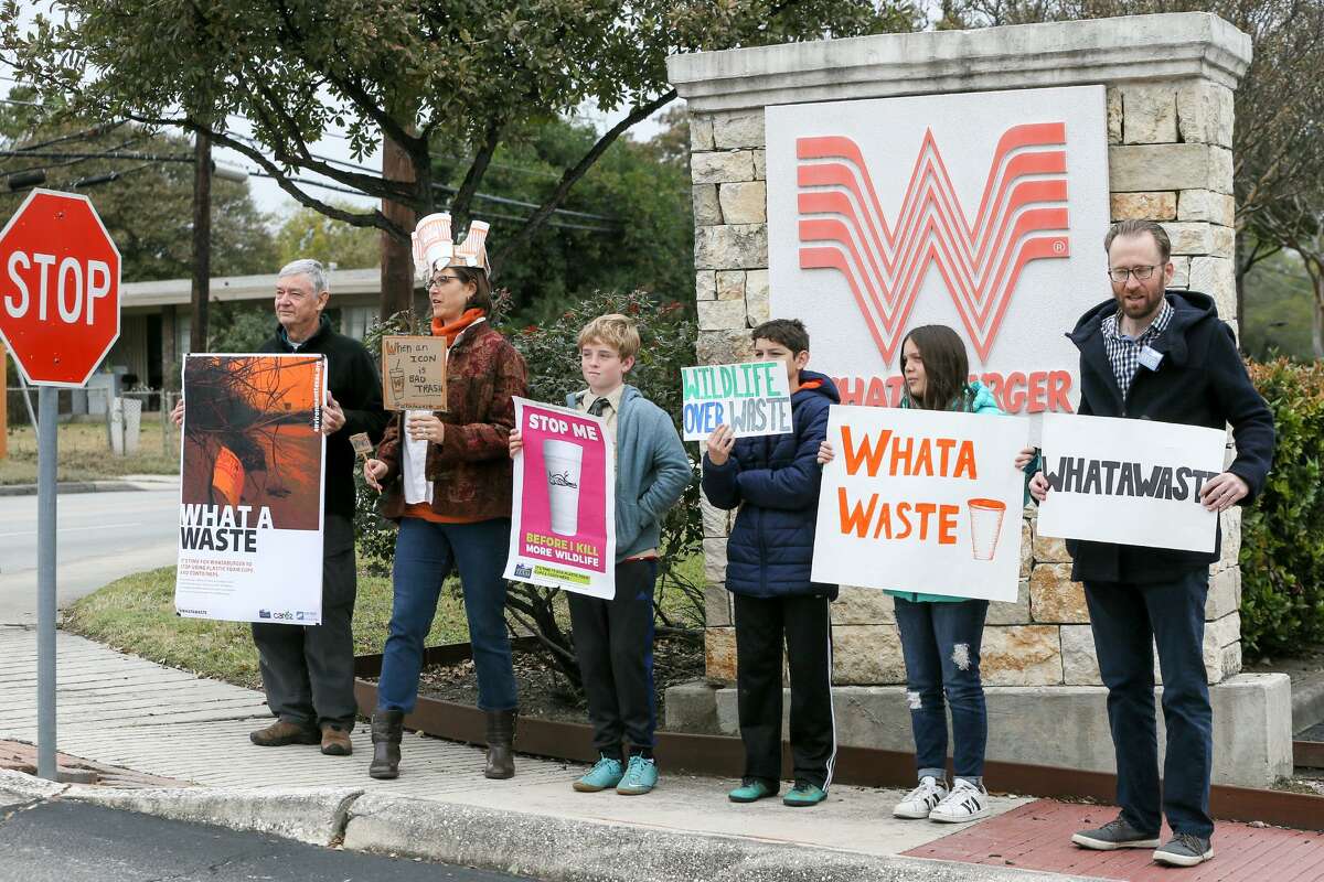 Alan Montemayor, from left; Carye Bye; Gustavo Metzger, 12; Emmanuel Perez, 12; Isabel Perez, 12; and Luke Metzger hold signs Monday outside Whataburger’s San Antonio headquarters at 300 Concord Plaza. The group then delivered a petition signed by more than 50,000 people that originated with environmental groups Environment Texas, Surfrider Foundation’s Texas Coastal Bend Chapter and Care2.com. The petition asks Whataburger to stop its use of polystyrene foam (commonly known as Styrofoam) cups and containers at its restaurants.