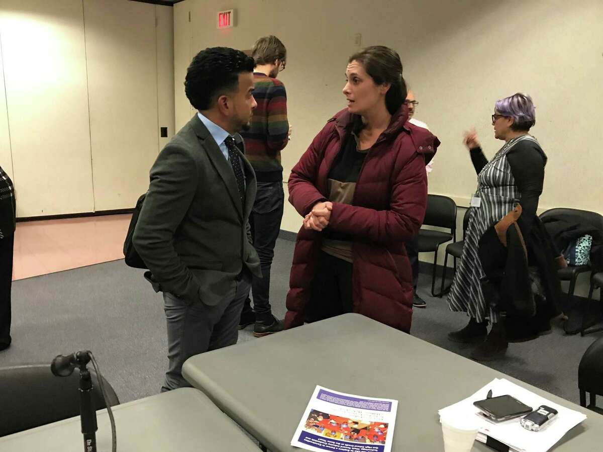 Board of Education Finance Committee chairman Jamell Cotto and parent Sarah Miller at Monday’s committee meeting in New Haven.