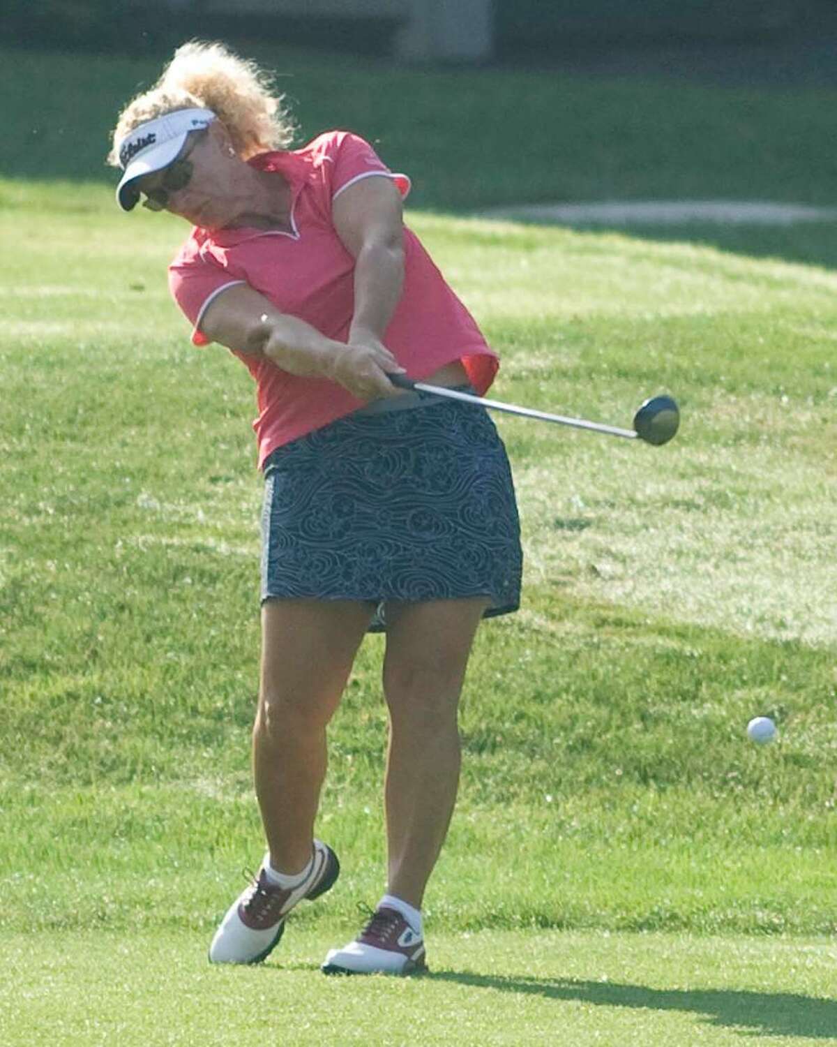 Defending women's champion Jen Holland hits a driver off the 10th tee during first round play in the 20th annual Danbury Amateur Tournament Saturday at Richter Park Golf Course.