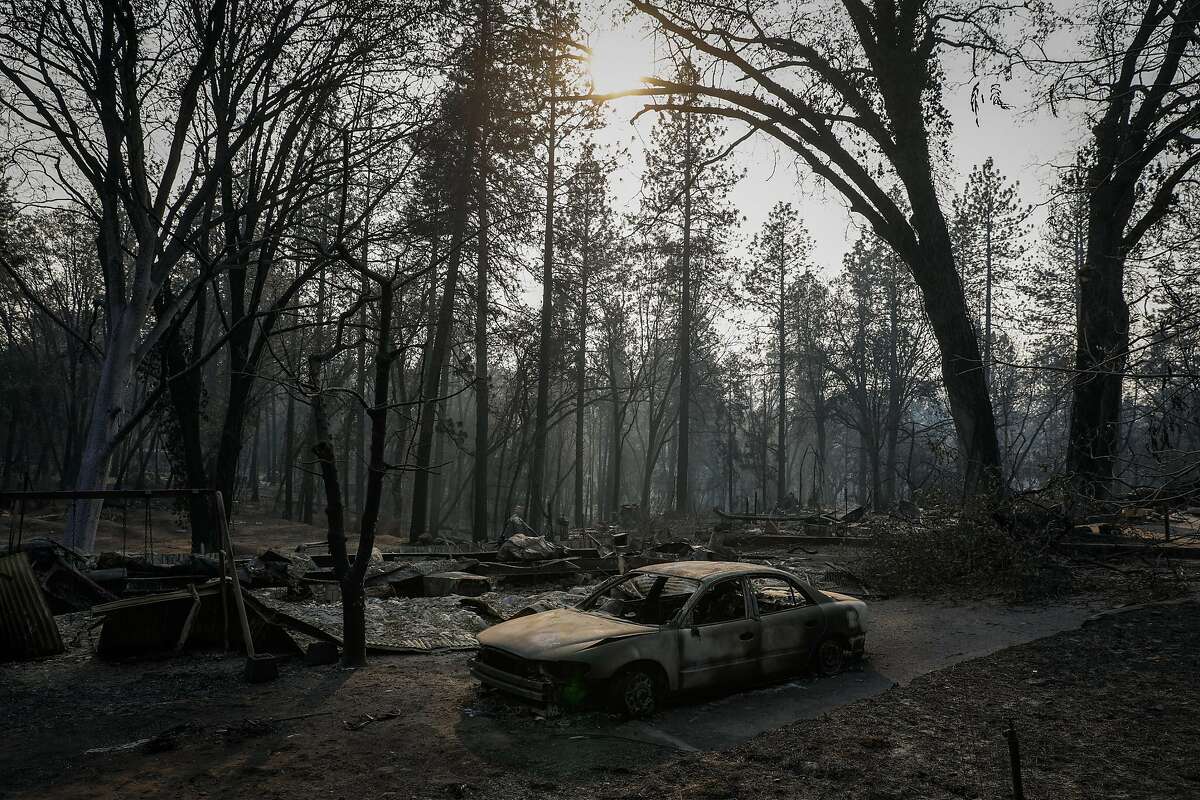 A burned out car on Pearson Road after the Camp Fire destroyed the town of Paradise, California, on Monday, Nov. 19, 2018.