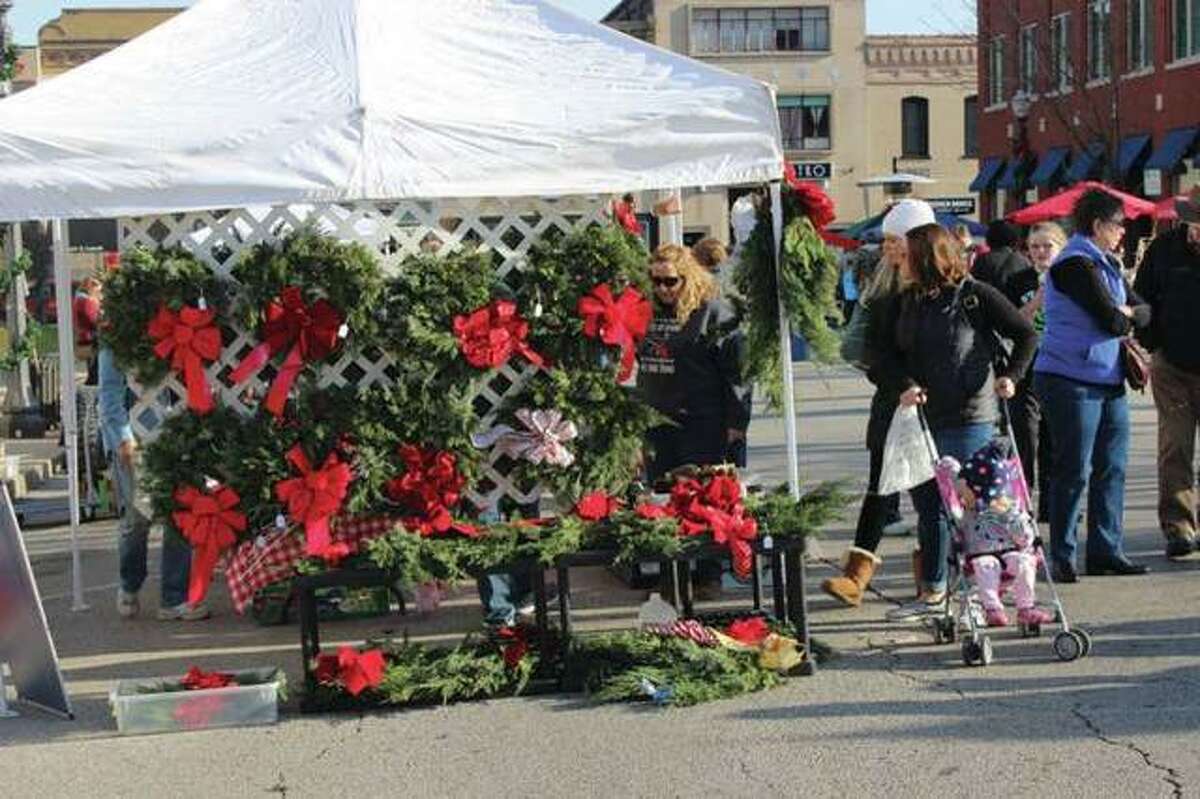 Patrons browse a previous year's Edwardsville Winter Market held downtown. This Saturday's market will double in size compared to last year's with around 90 total vendors.