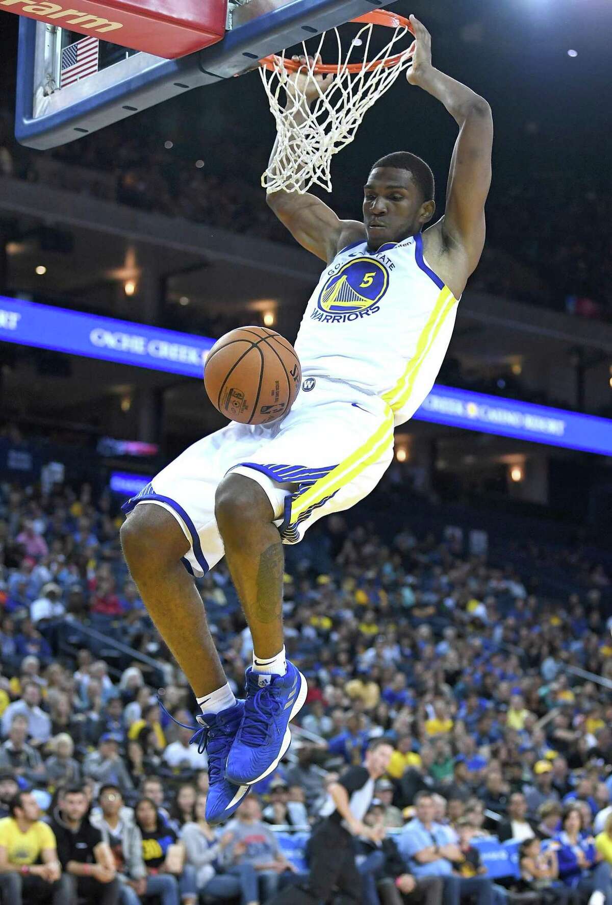 Kevon Looney, shown dunking in an exhibition game, has started the past two games.