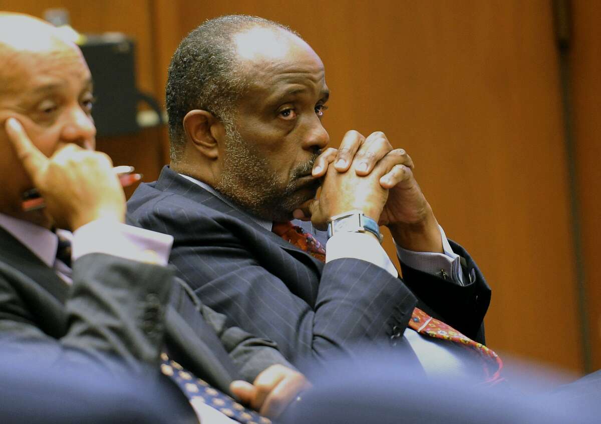 FILE - In this Thursday, Jan. 16, 2014, file photo, State Sen. Roderick Wright, D-Inglewood, right, listens during his perjury and voter fraud trial at Los Angeles Superior court. Roderick Wright has been convicted in a perjury and voter fraud case. A Los Angeles County Superior Court jury returned the verdict Tuesday, Jan. 28. 2014, on eight counts against the Democrat. Prosecutors said Wright sought to appear to have moved into an Inglewood property he owned in order to run in what at the time was the 25th Senate District but he actually lived outside the district. (AP Photo/The Daily Breeze, Stephen Carr, File)