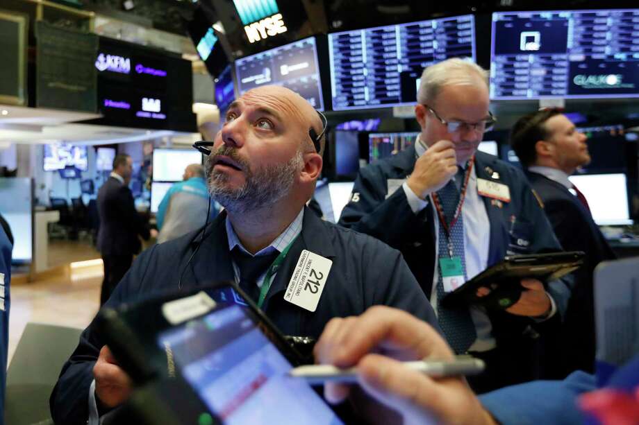 FILE- In this Friday, Nov. 9, 2018, file photo trader Vincent Napolitano, left, works on the floor of the New York Stock Exchange. The U.S. stock market opens at 9:30 a.m. EDT on Tuesday, Nov. 20. (AP Photo/Richard Drew, File) Photo: Richard Drew / Copyright 2018 The Associated Press. All rights reserved