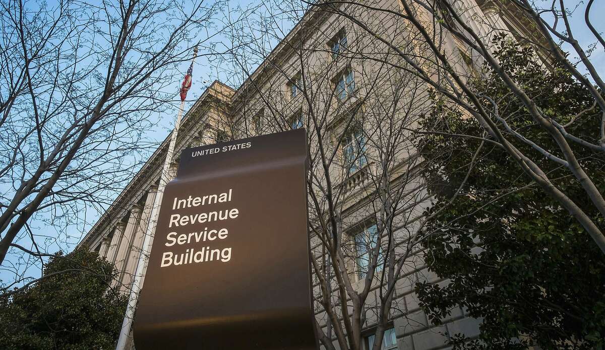FILE - This April 13, 2014, file photo shows the Internal Revenue Service (IRS) headquarters building in Washington. IRS investigative analyst John Fry, 54, was charged in federal court in San Francisco on Feb. 4 in a criminal complaint filed under seal.