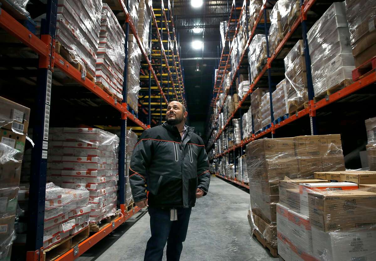 Jason Dreisbach, president of Dreisbach Enterprises, views the inventory stored in the zero degree freezer inside the Lineage Cool Port Oakland temperature controlled distribution center at the Port of Oakland, in Oakland, Calif. on Tuesday, Nov. 20, 2018. Up to one million tons of meat and other perishable products destined for overseas markets annually will be transferred from railcars and truck trailers to refrigerated containers at the 280,000 sq. ft. facility jointly operated by Lineage Logistics and Dreisbach Enterprises.