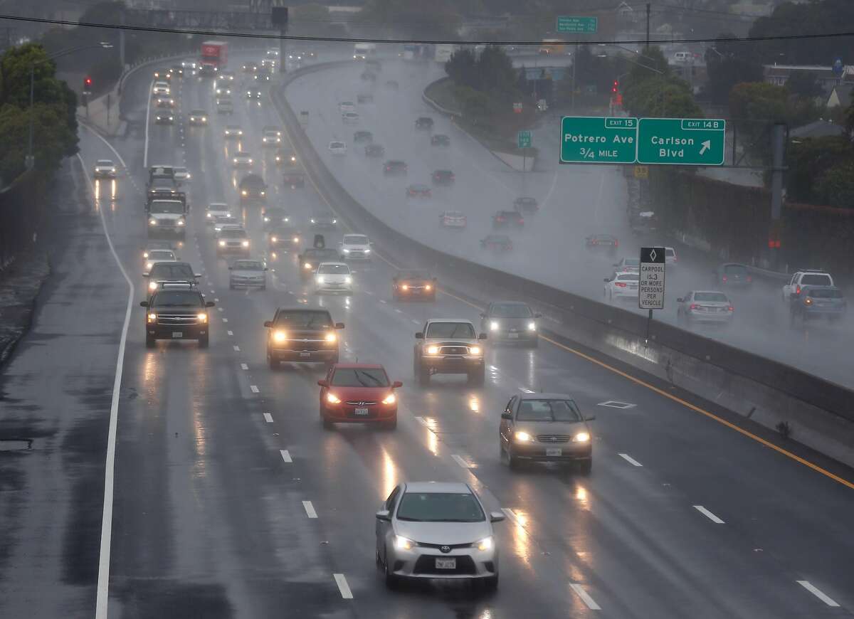 Commuters drive on rain soaked lanes of Interstate 80 during the first significant storm of the season in Richmond, Calif. on Wednesday, Nov. 21, 2018.