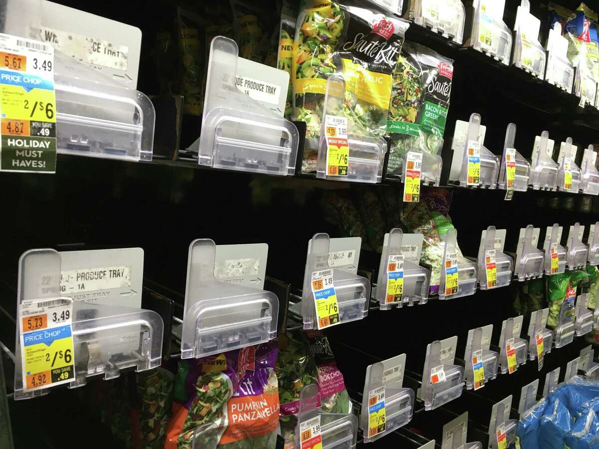 Shelves usually stocked with mixed lettuce bags and other leafy green products were bare Wednesday as stores pulled romaine lettuce from their shelves following a CDC food safety alert.
