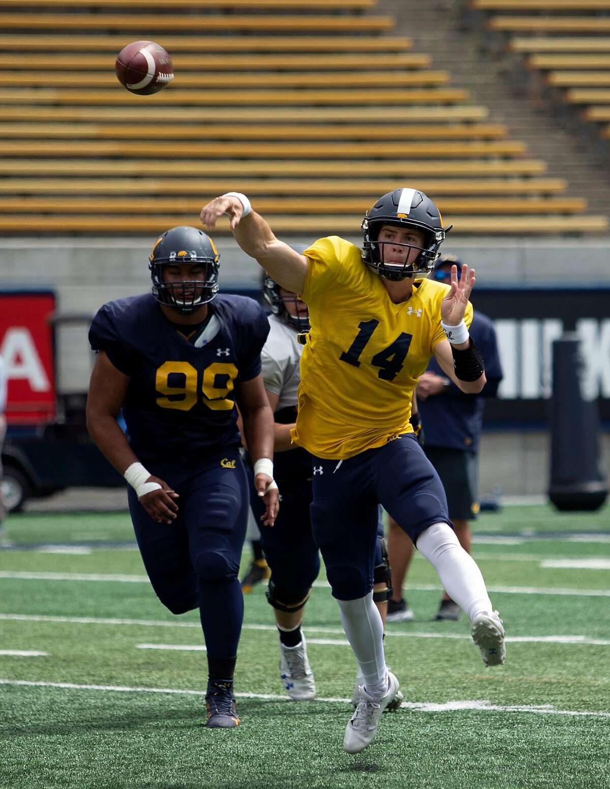 California quarterback Chase Forrest (14) throws on the run during the spring football scrimmage at Memorial Stadium, Saturday, April 28, 2018 in Berkeley, Calif.