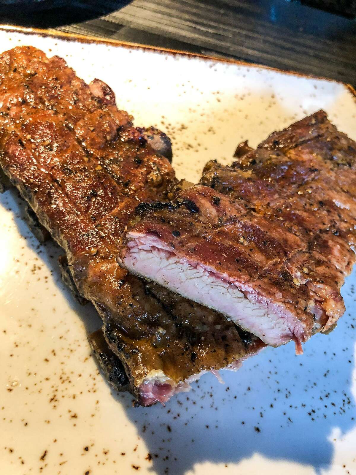 The owners of Blacket, a barbecue restaurant in Como, Italy, was inspired by a trip to Texas where the owners first tasted barbecue. Shown: pork ribs.
