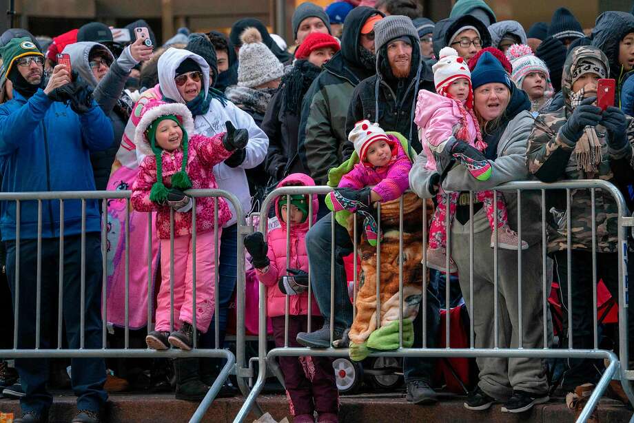 The crowd rushes against the cold to attend Macy's 92nd Annual Thanksgiving Parade on November 22, 2018 in New York City. (EMMERT DON / AFP / Getty Images) Photo: DON EMMERT, AFP / Getty Images