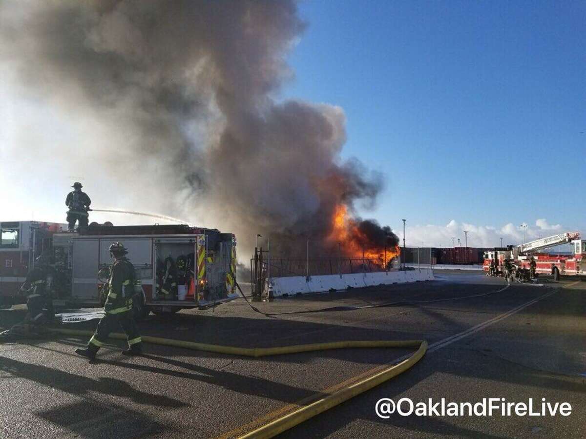 A fire burned through three big rigs and one trailer Thursday morning at the Port of Oakland.